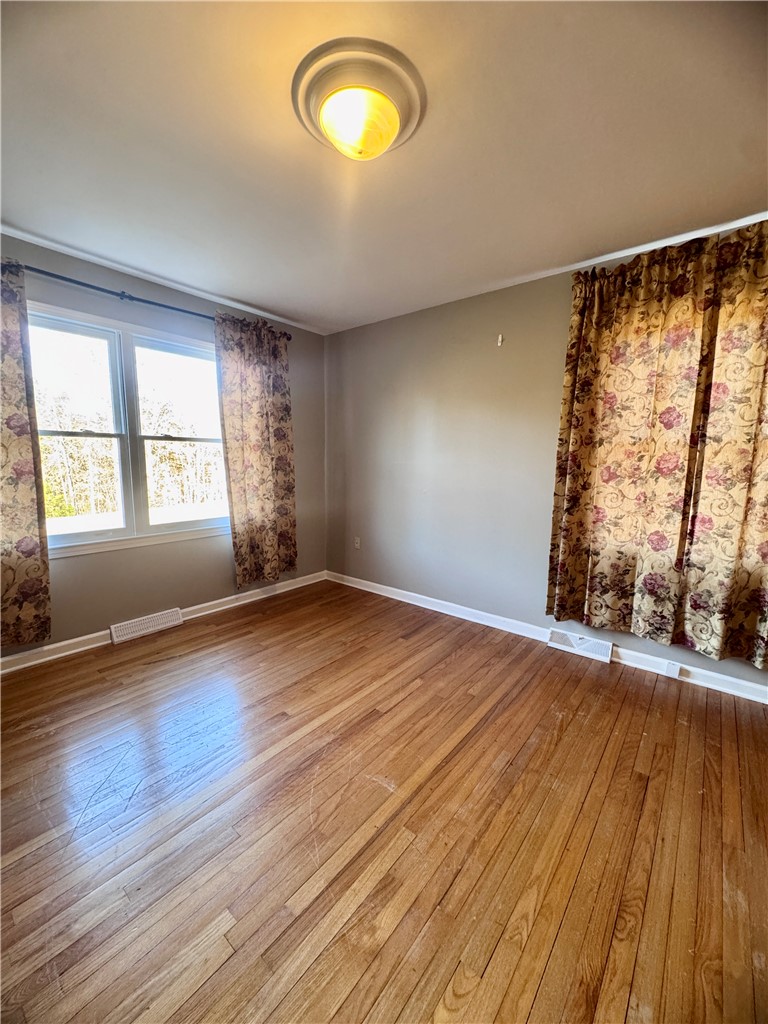 208 Pilgrim Circle Pickens, SC 29671 - Photo 21 of 29 Bright windows and hardwood floors create a welcoming atmosphere in this spacious room.