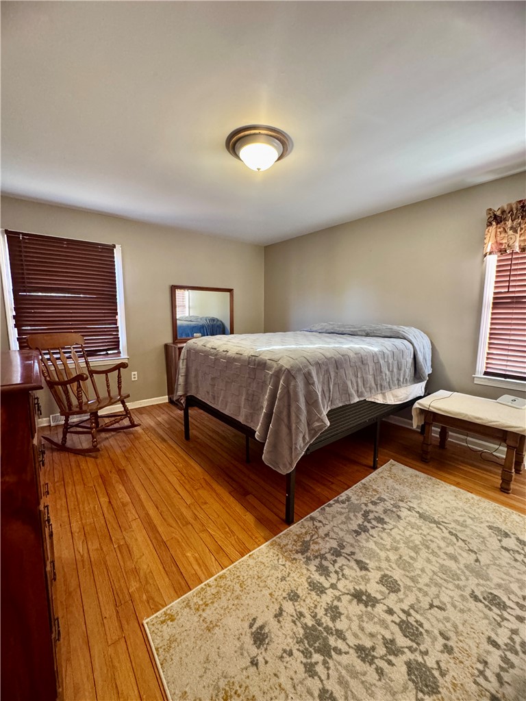 208 Pilgrim Circle Pickens, SC 29671 - Photo 23 of 29 This inviting bedroom features rich hardwood flooring, creating a warm and comfortable retreat.