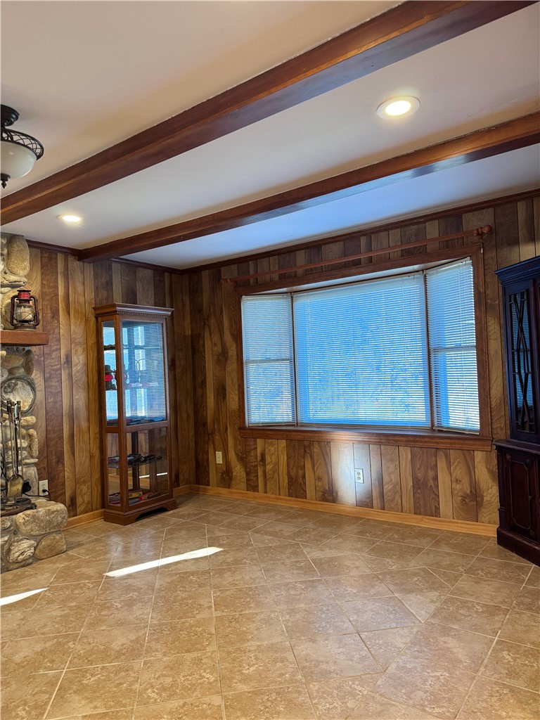 208 Pilgrim Circle Pickens, SC 29671 - Photo 8 of 29 Warm wood paneling and exposed beams create a cozy and inviting atmosphere in this living area.