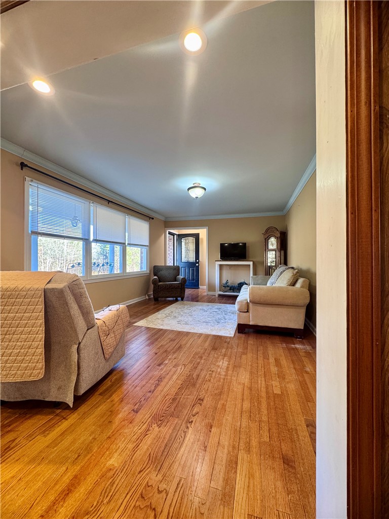 208 Pilgrim Circle Pickens, SC 29671 - Photo 9 of 29 This inviting living space features gleaming hardwood floors and ample natural light, creating a welcoming atmosphere.