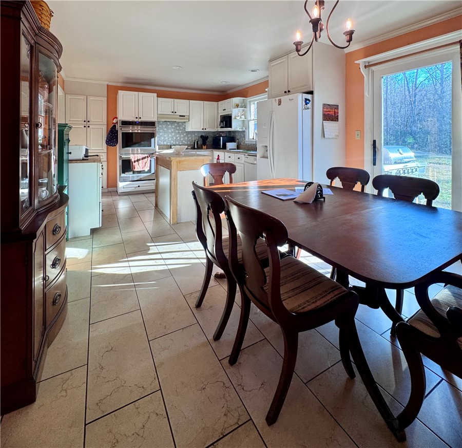 208 Pilgrim Circle Pickens, SC 29671 - Photo 10 of 29 Bright and open-concept kitchen with a dining area, perfect for gatherings.