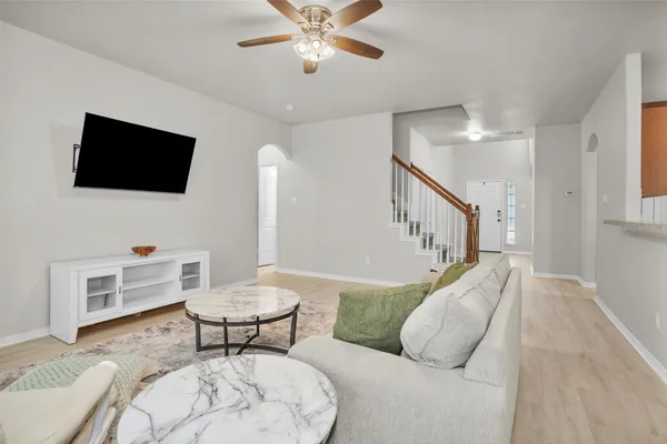 a living room with furniture and a flat screen tv
