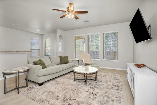 a living room with furniture and a flat screen tv