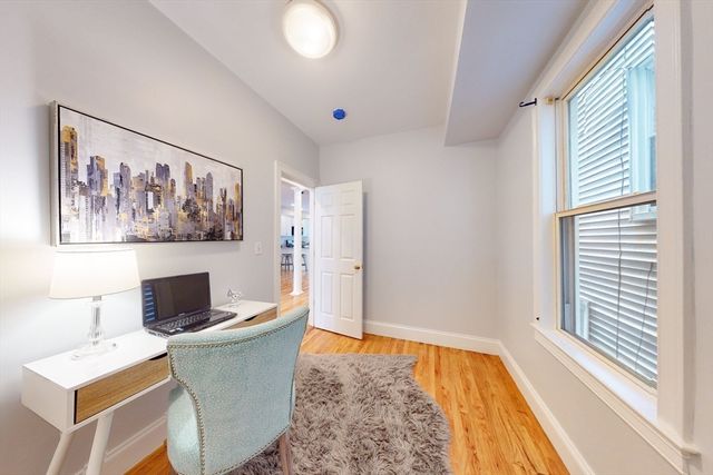 a living room with a couch and a flat screen tv
