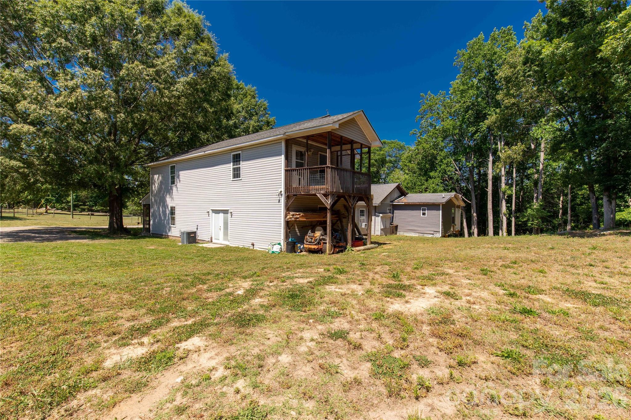 1845 State Rd S-46-149 Clover, SC 29710 - Photo 20 of 28 a front view of a house with a garden
