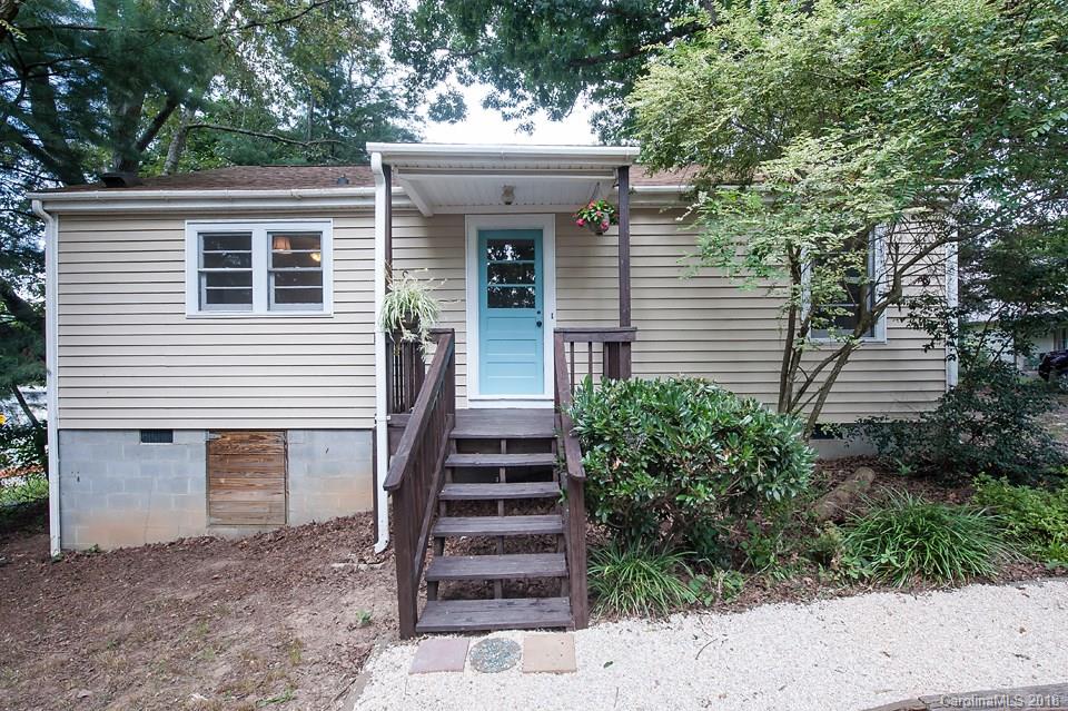 288 Deaverview Road, Unit B Asheville, NC 28806 - Photo 2 of 28 a view of a house with potted plants and a large tree