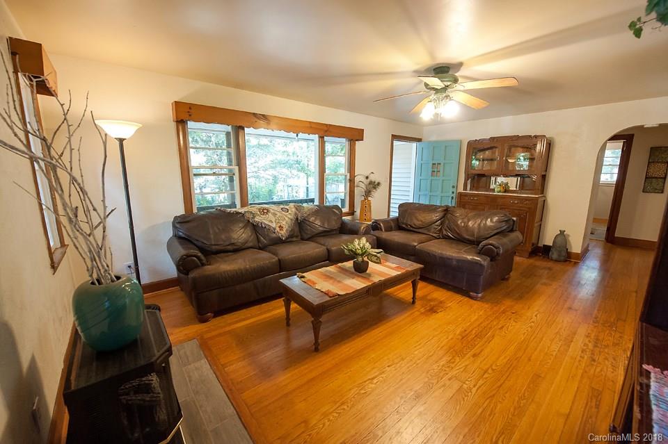 288 Deaverview Road, Unit B Asheville, NC 28806 - Photo 12 of 28 a living room with furniture and a flat screen tv