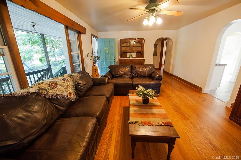 288 Deaverview Road, Unit B Asheville, NC 28806 - Photo 13 of 28 a living room with furniture and wooden floor