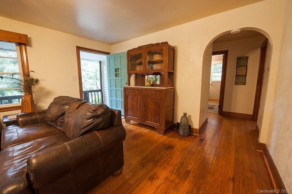 288 Deaverview Road, Unit B Asheville, NC 28806 - Photo 15 of 28 a living room with furniture and a wooden floor