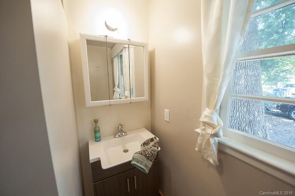 288 Deaverview Road, Unit B Asheville, NC 28806 - Photo 19 of 28 a bathroom with a sink and a mirror
