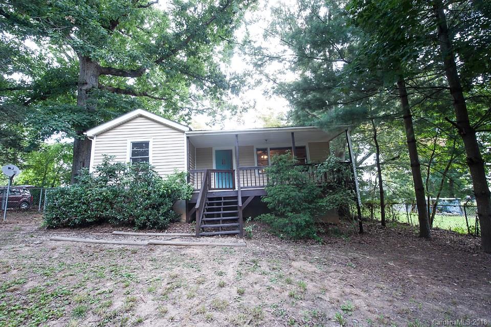 288 Deaverview Road, Unit B Asheville, NC 28806 - Photo 27 of 28 a house with trees in front of it