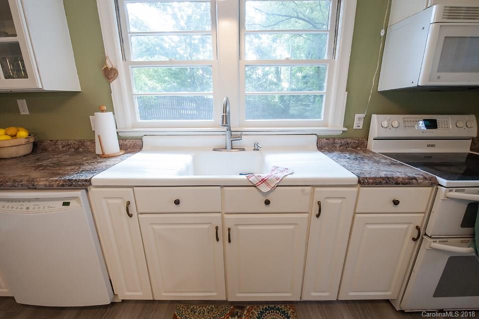 288 Deaverview Road, Unit B Asheville, NC 28806 - Photo 5 of 28 a view of washer and dryer with a wooden floor