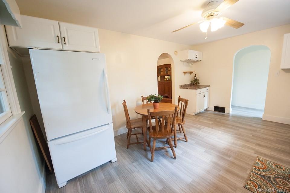 288 Deaverview Road, Unit B Asheville, NC 28806 - Photo 7 of 28 a view of a dining room with furniture and wooden floor