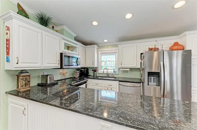 a kitchen with a stove and cabinets