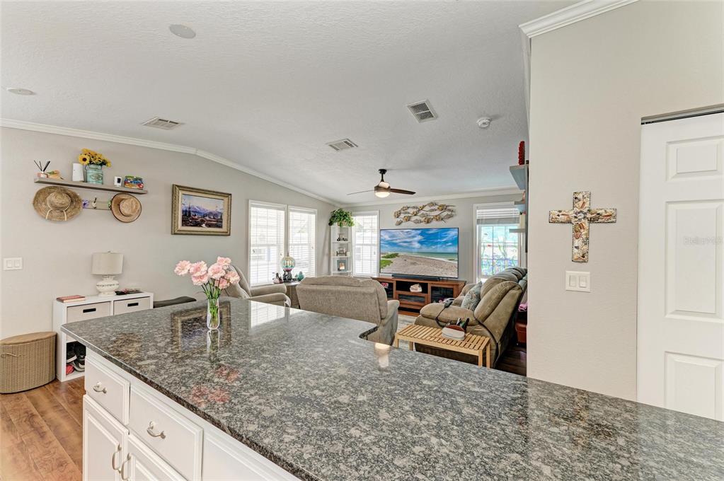 12507 Cortez Road West, Unit 35 Cortez, FL 34215 - Photo 17 of 36 a living room with furniture and a flat screen tv