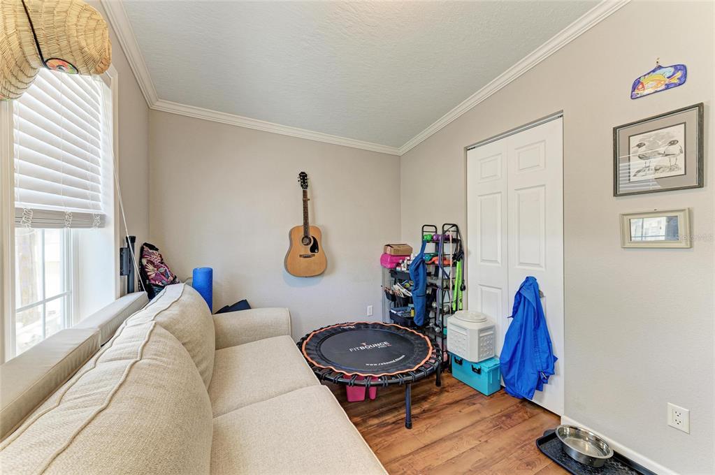 12507 Cortez Road West, Unit 35 Cortez, FL 34215 - Photo 24 of 36 a living room with furniture and a wooden floor