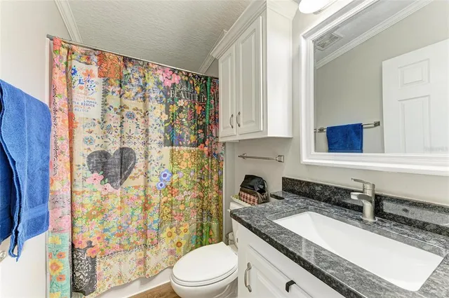 a utility room with dryer washer and shoe rack