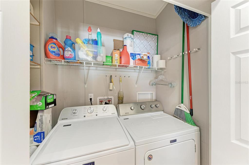 12507 Cortez Road West, Unit 35 Cortez, FL 34215 - Photo 26 of 36 a utility room with dryer washer and shoe rack
