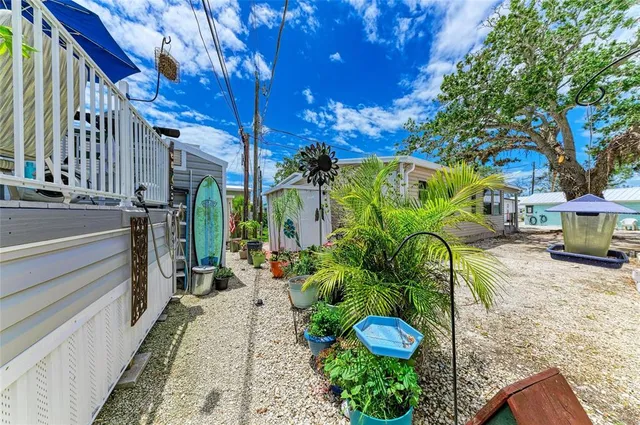a view of balcony with furniture and umbrella