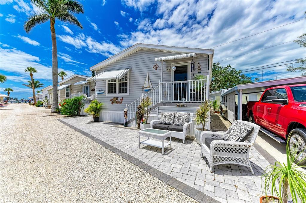12507 Cortez Road West, Unit 35 Cortez, FL 34215 - Photo 3 of 36 a house view with a sitting space fire pit and outdoor space