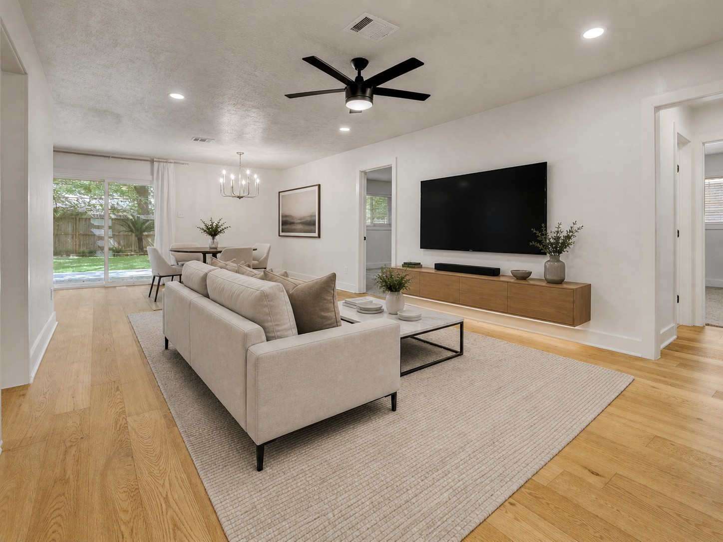 5514 Indigo Street Houston, TX 77096 - Photo 7 of 22 a living room with furniture and a flat screen tv