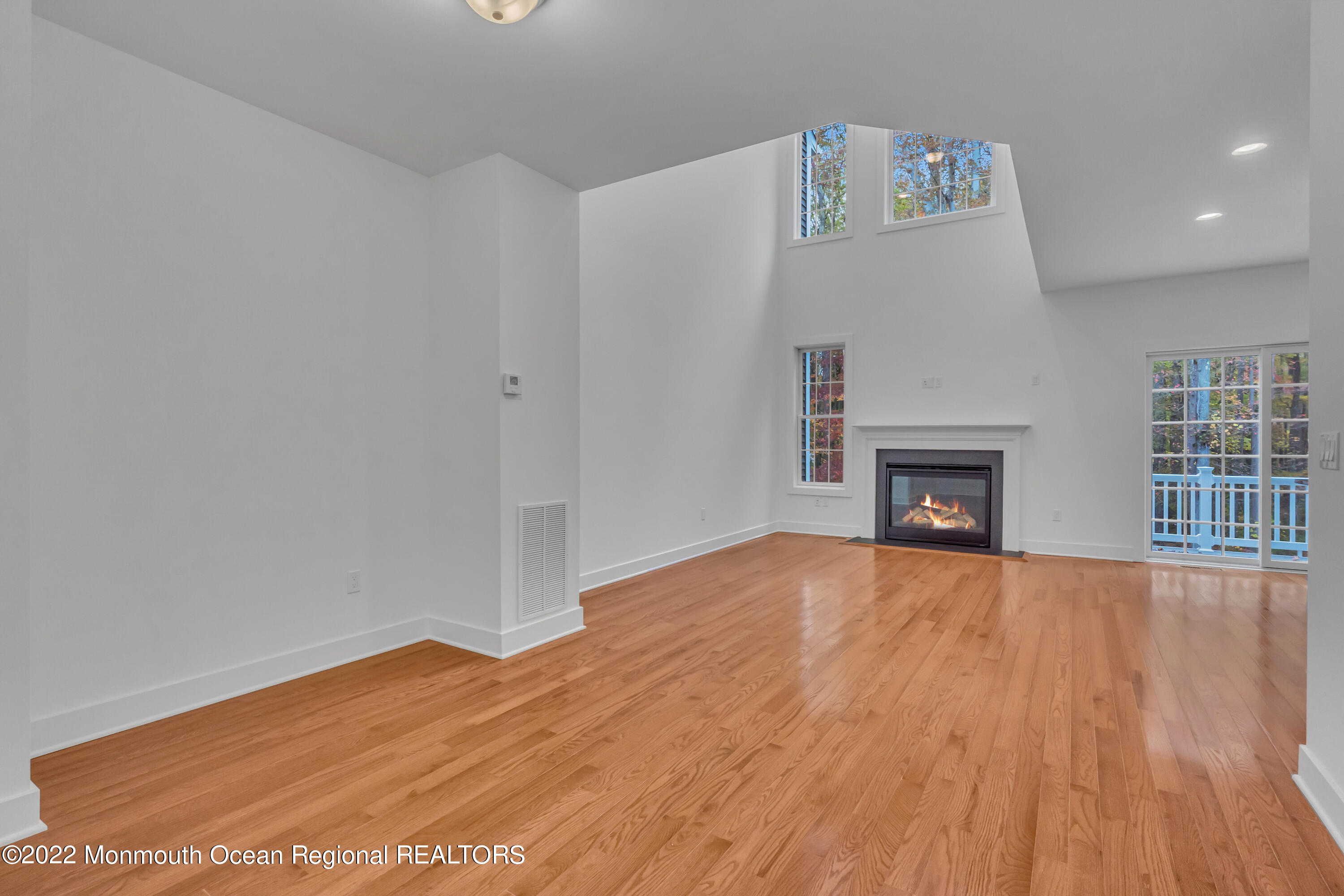 26 Kitchen Avenue Old Bridge, NJ 08857 - Photo 11 of 38 a view of empty room with wooden floor and fireplace