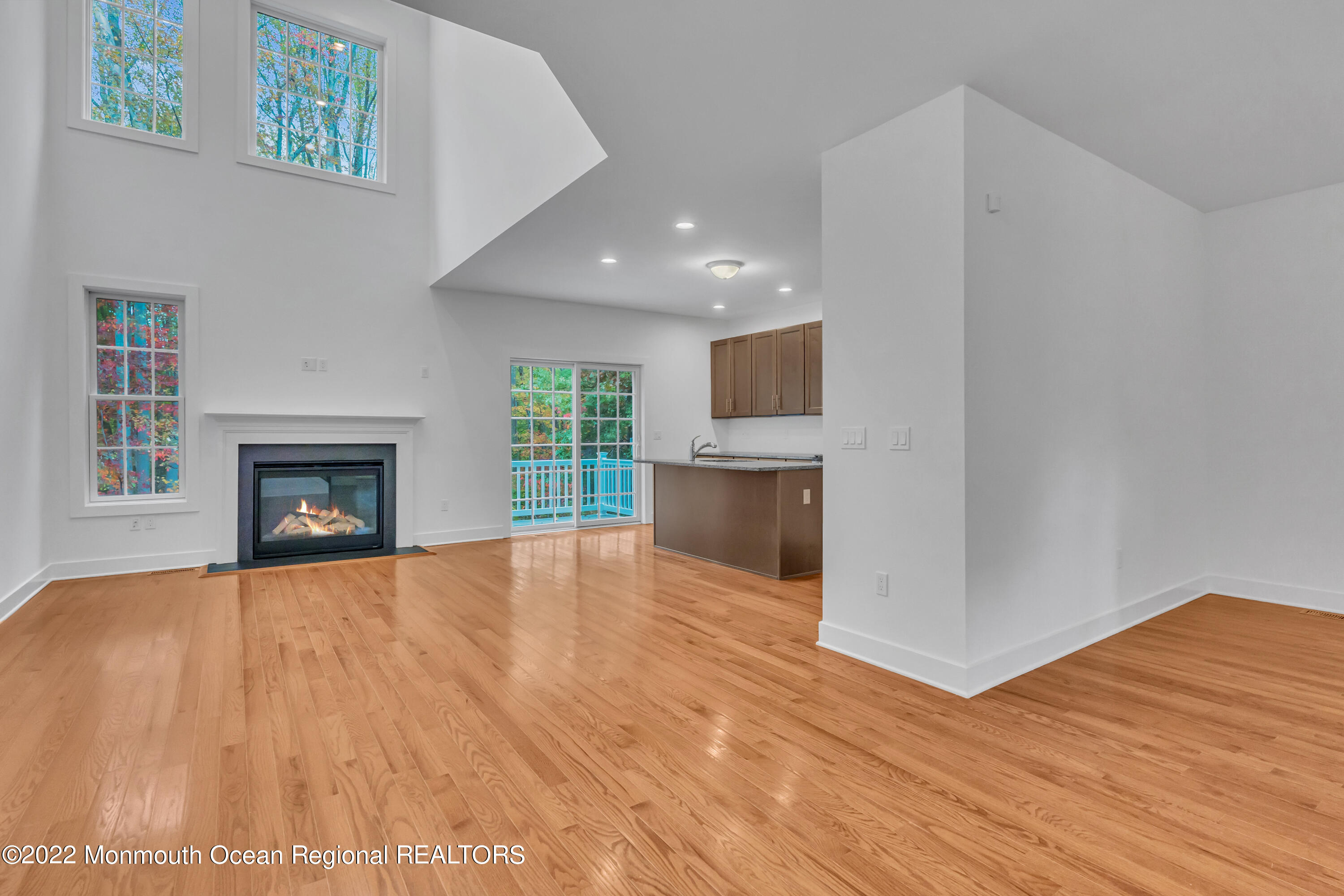 26 Kitchen Avenue Old Bridge, NJ 08857 - Photo 12 of 38 a view of empty room with wooden floor and fireplace