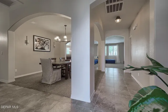 an entryway and a livingroom with furniture