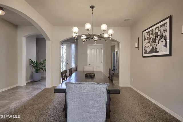 a view of a hallway with a chandelier