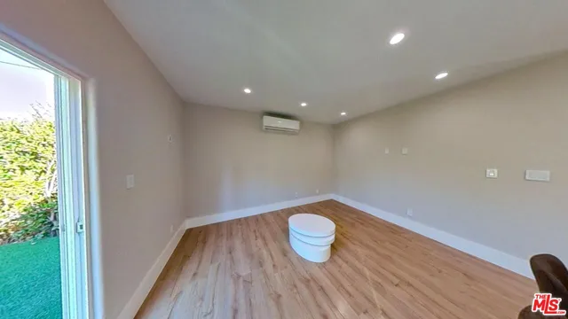 a view of wooden floor in an empty room