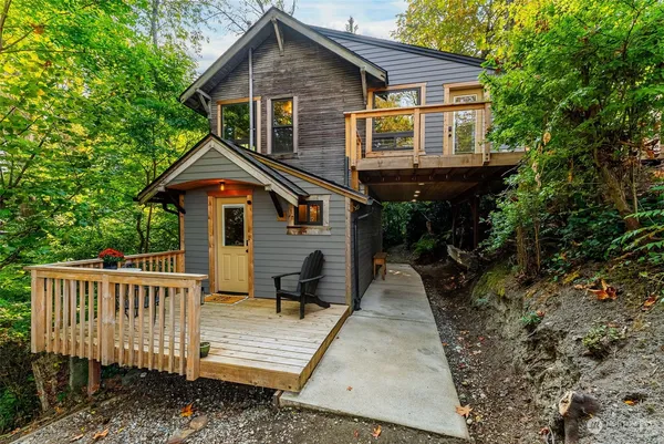 a view of house with a yard and patio