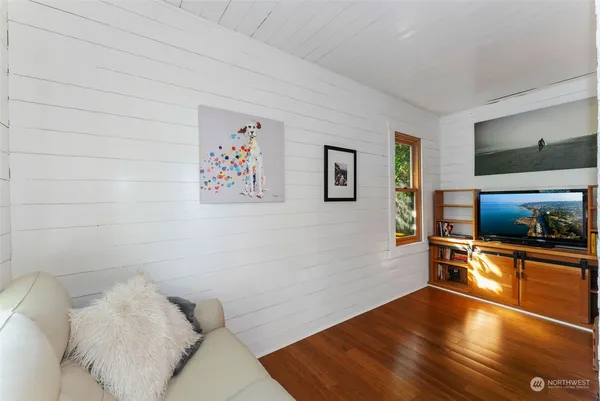 a living room with a flat screen tv and a couch