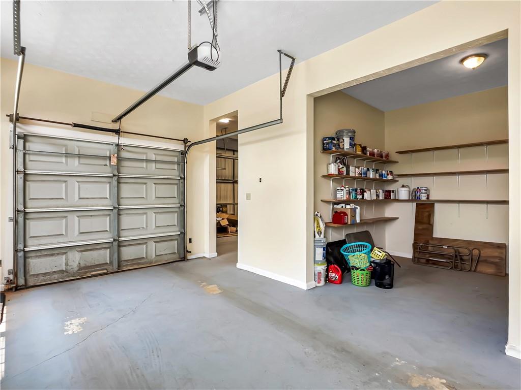 335 Canvasback Trail Locust Grove, GA 30248 - Photo 11 of 91 a view of a garage with storage