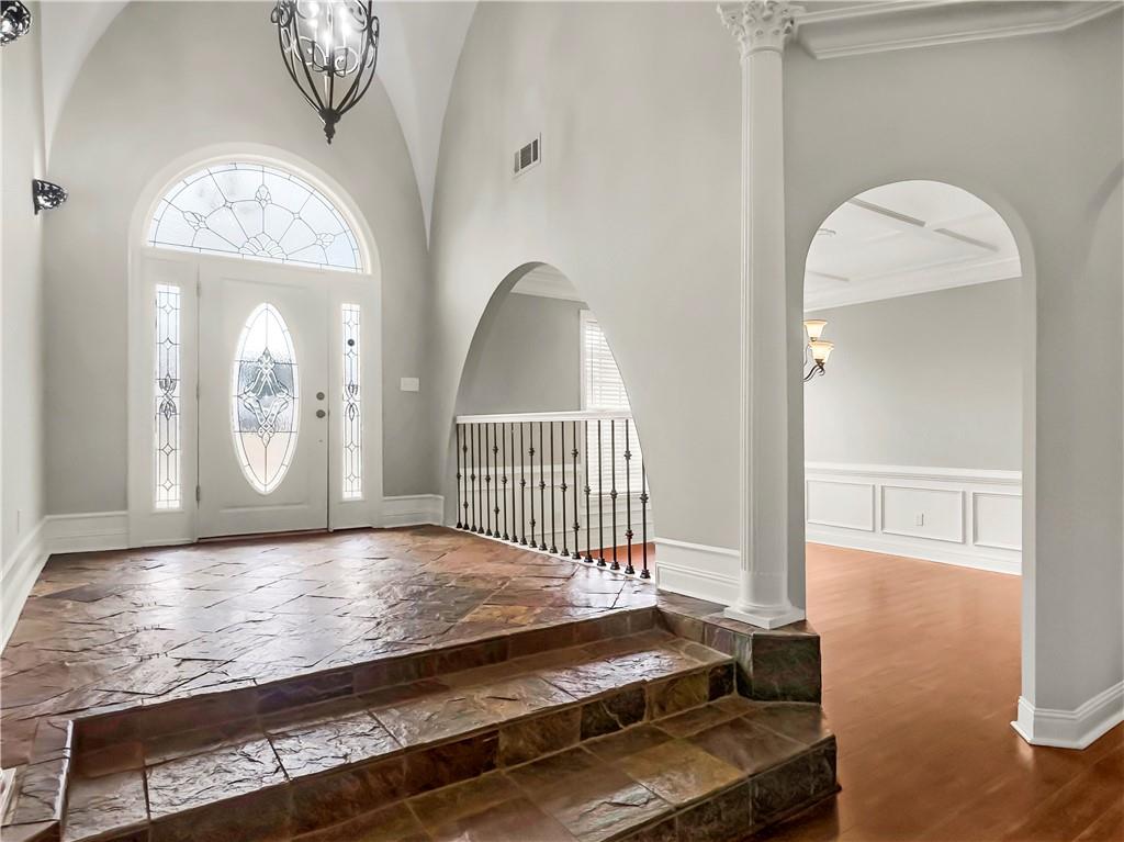 335 Canvasback Trail Locust Grove, GA 30248 - Photo 16 of 91 a view of a room with wooden floor and mirror