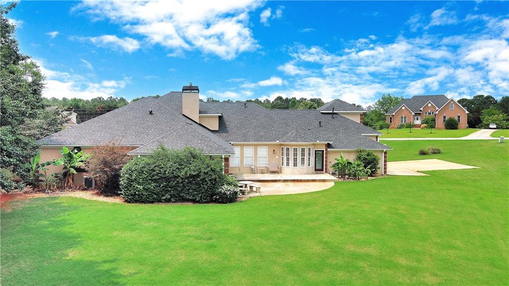 335 Canvasback Trail Locust Grove, GA 30248 - Photo 2 of 91 a front view of house with yard and green space