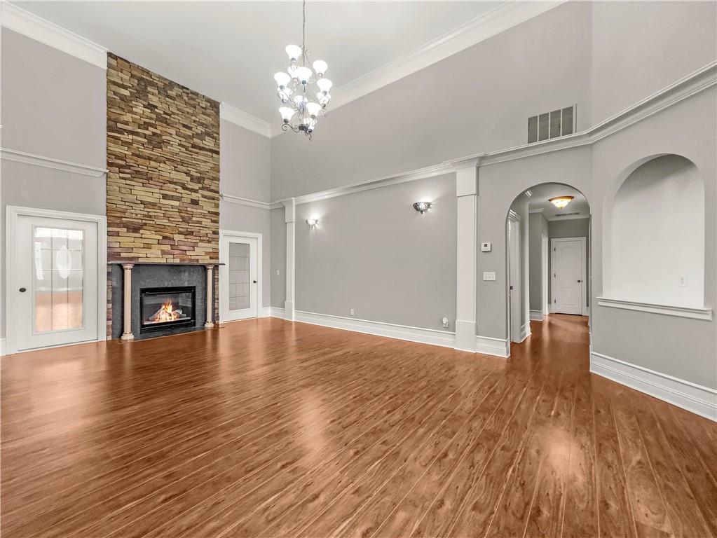 335 Canvasback Trail Locust Grove, GA 30248 - Photo 22 of 91 a view of a livingroom with wooden floor fireplace and window