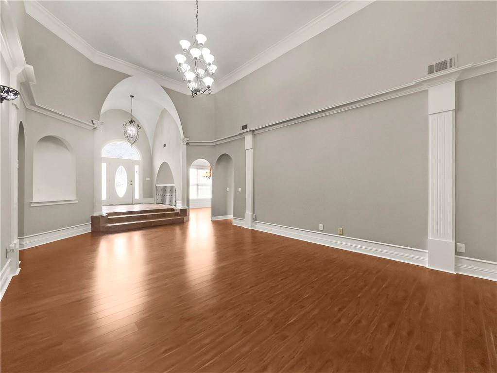335 Canvasback Trail Locust Grove, GA 30248 - Photo 24 of 91 wooden floor in an empty room with a window