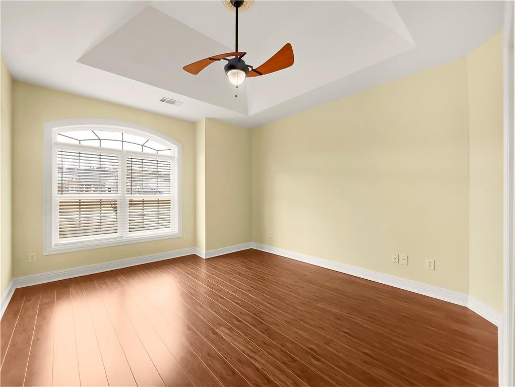 335 Canvasback Trail Locust Grove, GA 30248 - Photo 28 of 91 a view of an empty room with wooden floor and a window