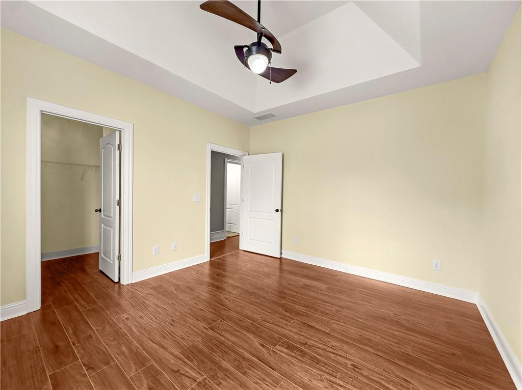 335 Canvasback Trail Locust Grove, GA 30248 - Photo 33 of 91 a view of an empty room with wooden floor