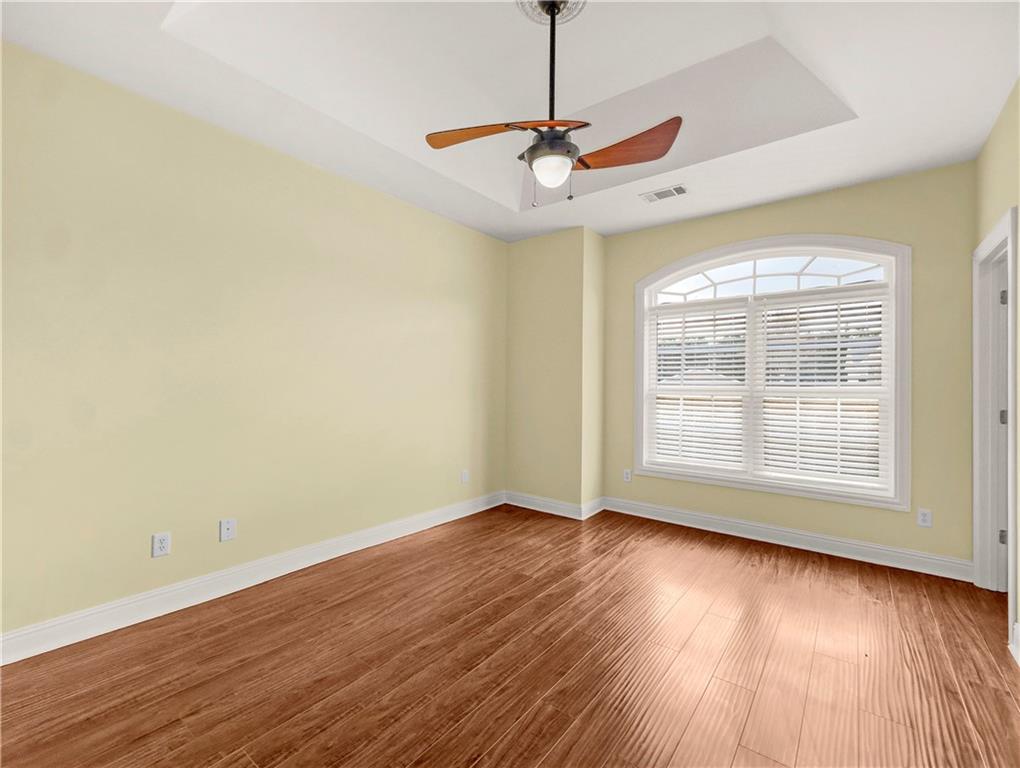 335 Canvasback Trail Locust Grove, GA 30248 - Photo 34 of 91 a view of an empty room with wooden floor and a window