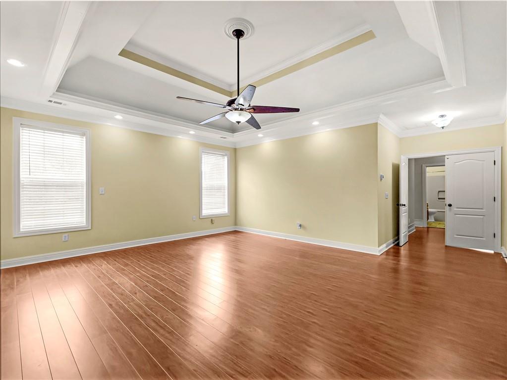 335 Canvasback Trail Locust Grove, GA 30248 - Photo 40 of 91 a view of a livingroom with a ceiling fan window and wooden floor