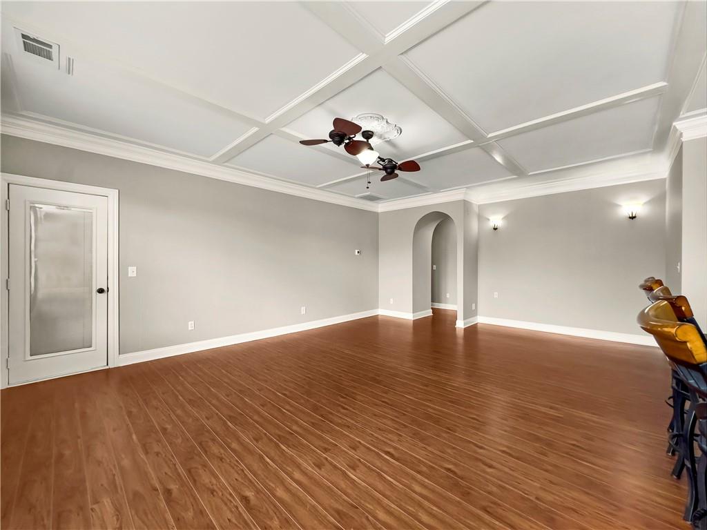 335 Canvasback Trail Locust Grove, GA 30248 - Photo 48 of 91 a view of an empty room with window and wooden floor