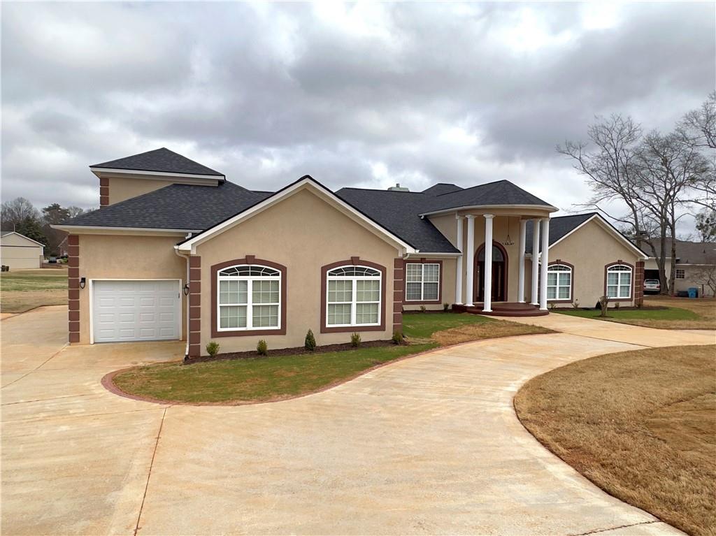 335 Canvasback Trail Locust Grove, GA 30248 - Photo 56 of 91 a front view of a house with a yard
