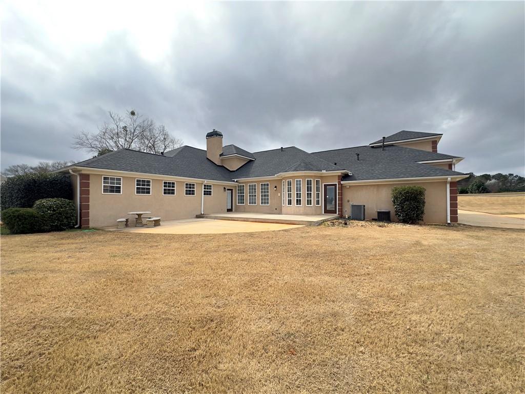 335 Canvasback Trail Locust Grove, GA 30248 - Photo 58 of 91 a front view of a house with a yard and garage
