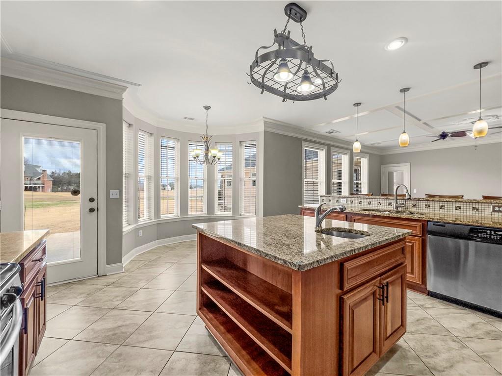 335 Canvasback Trail Locust Grove, GA 30248 - Photo 75 of 91 a kitchen with stainless steel appliances granite countertop a sink and a stove
