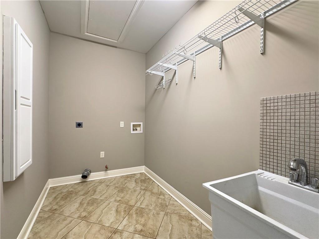 335 Canvasback Trail Locust Grove, GA 30248 - Photo 77 of 91 a bathroom with a sink and shower