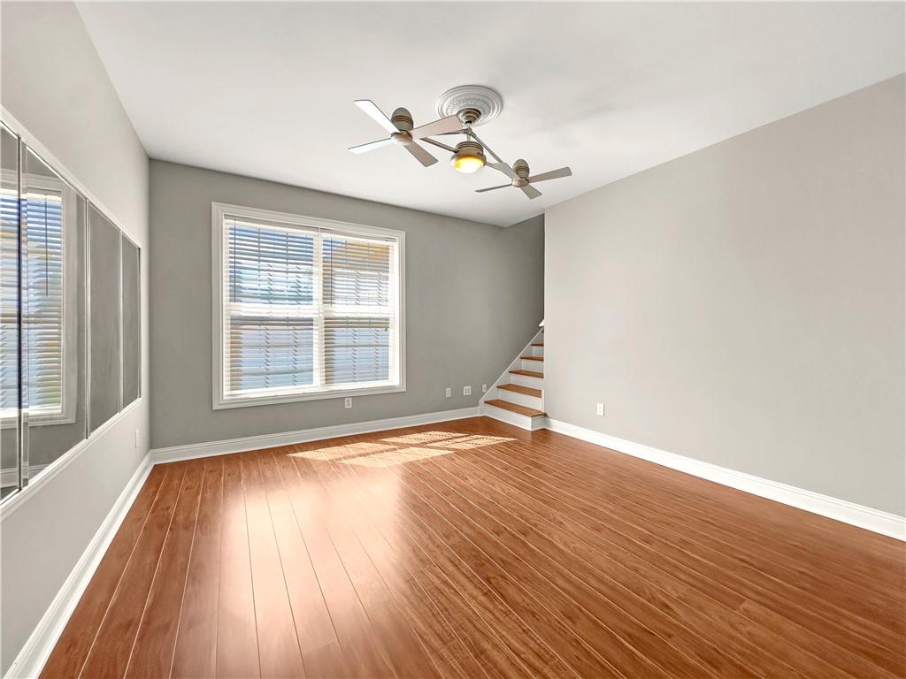 335 Canvasback Trail Locust Grove, GA 30248 - Photo 79 of 91 a view of an empty room with wooden floor and a window