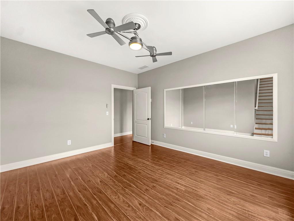 335 Canvasback Trail Locust Grove, GA 30248 - Photo 82 of 91 wooden floor in an empty room with a window