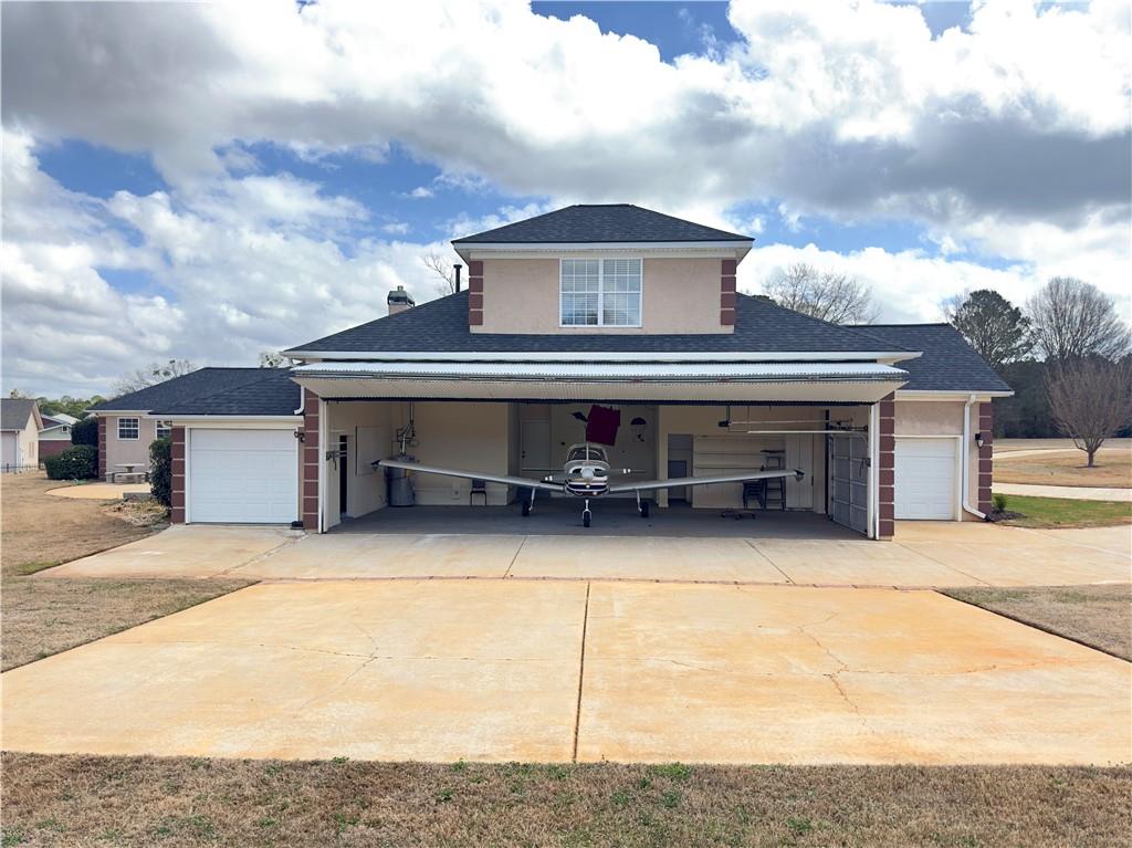 335 Canvasback Trail Locust Grove, GA 30248 - Photo 90 of 91 a front view of a house with a garage