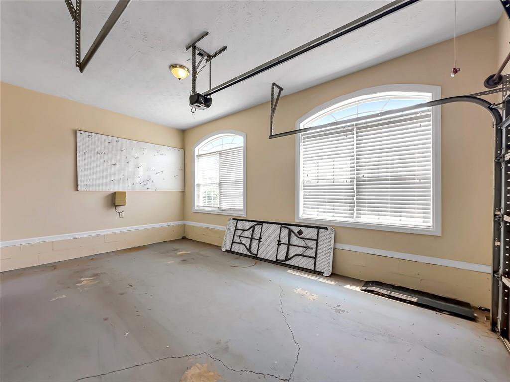 335 Canvasback Trail Locust Grove, GA 30248 - Photo 9 of 91 a view of an empty room with a window